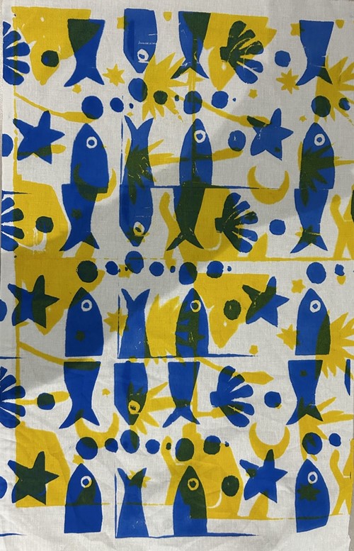 Screen-printed fabric with blue fish, yellow shapes and stars