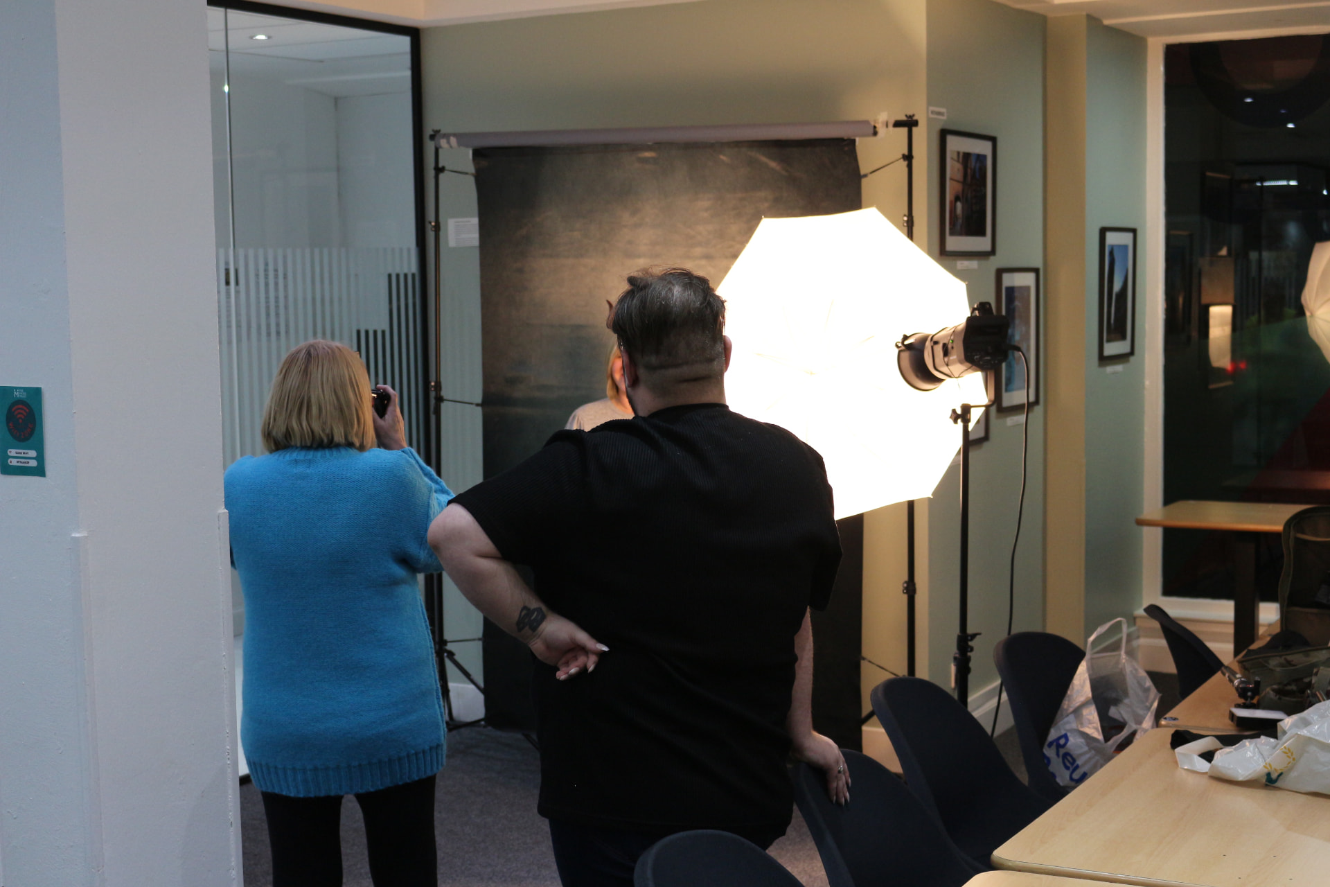A photography class in progress with studio lighting