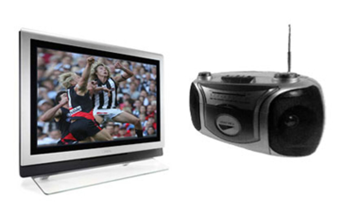 A flat-screen television next to a portable radio