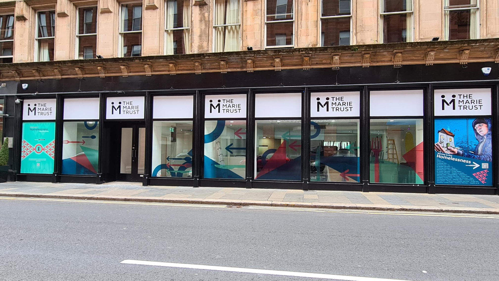 The Marie Trust building on Albion Street, Glasgow, with branded window graphics