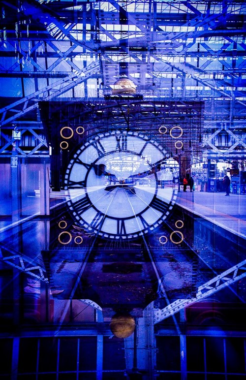 Double exposure of the station clock and glass roof at Glasgow Central